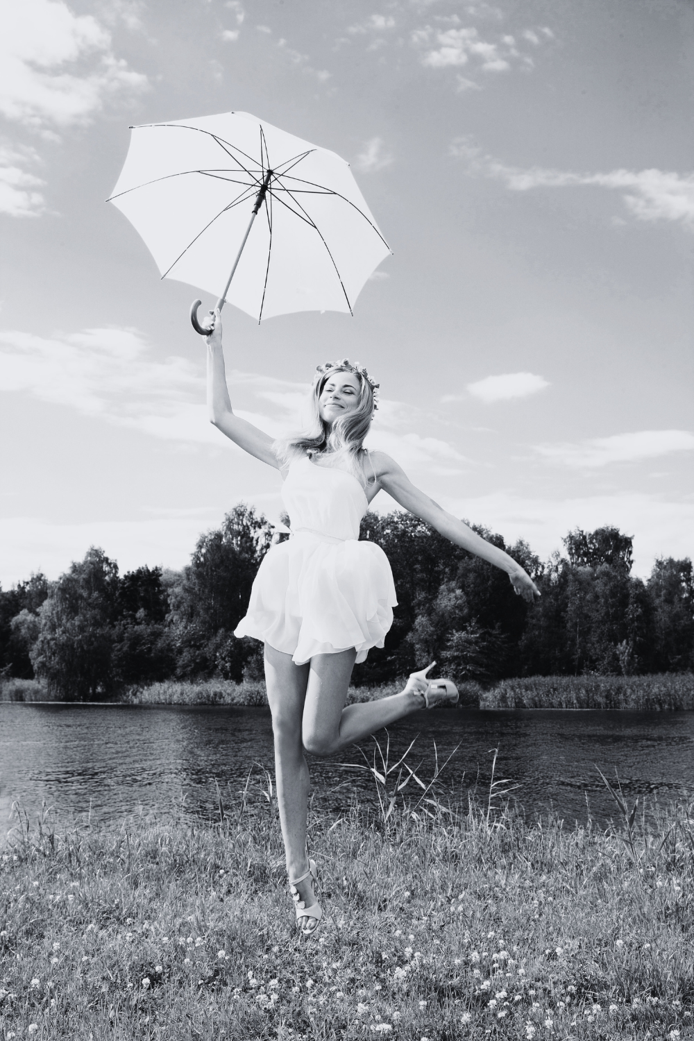 Black-and-white photo of the lady in high spirits—symbolizing accomplishment and success