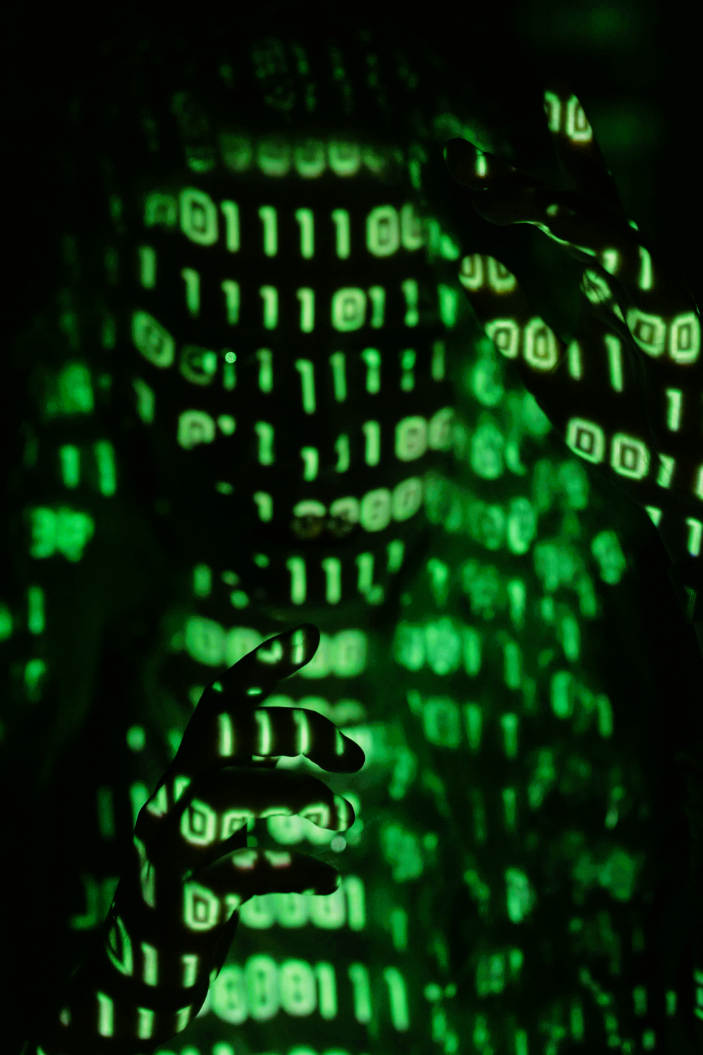 Green code lines on a dark background conveying digital complexity.