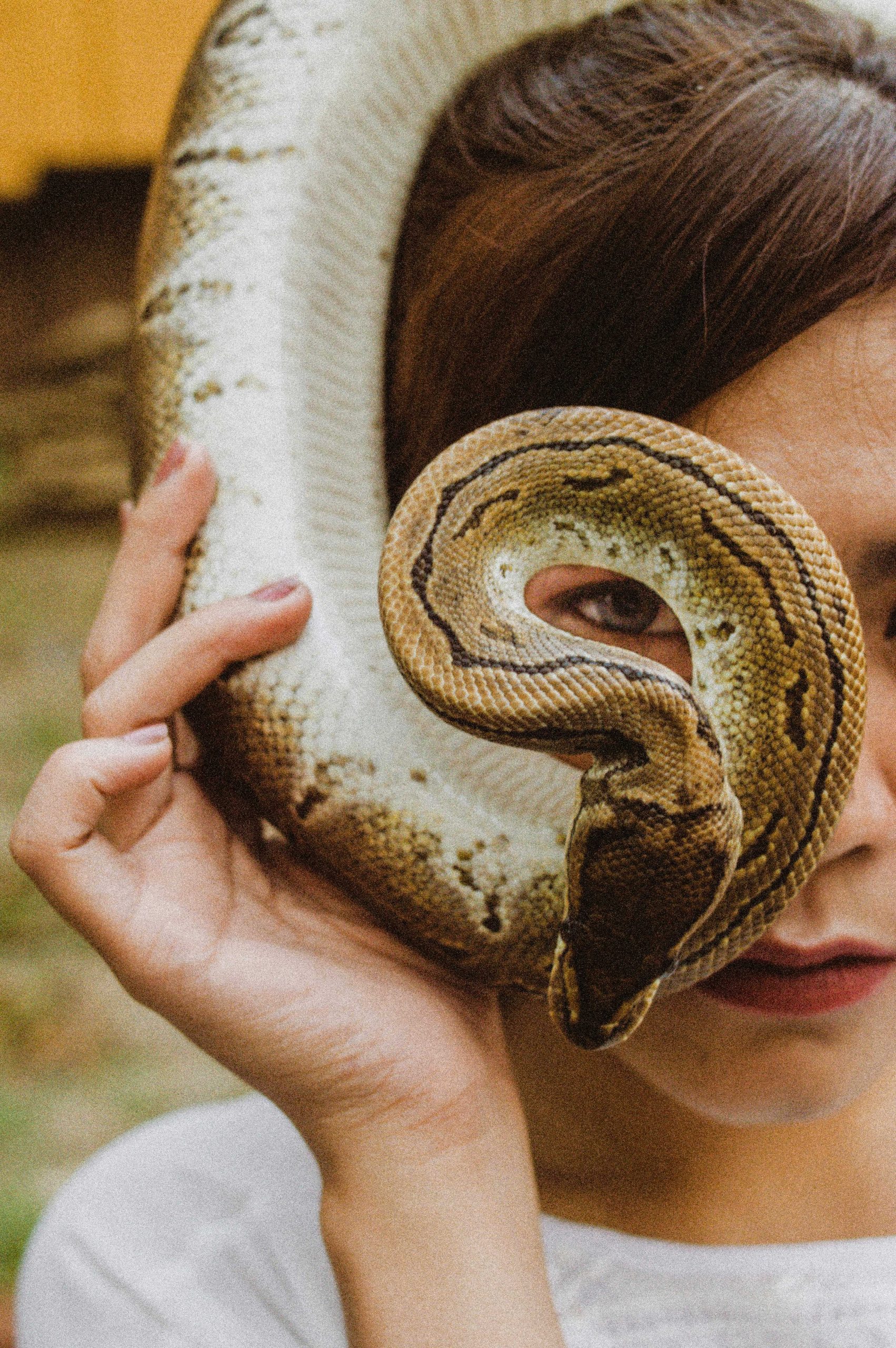 female holding a snake