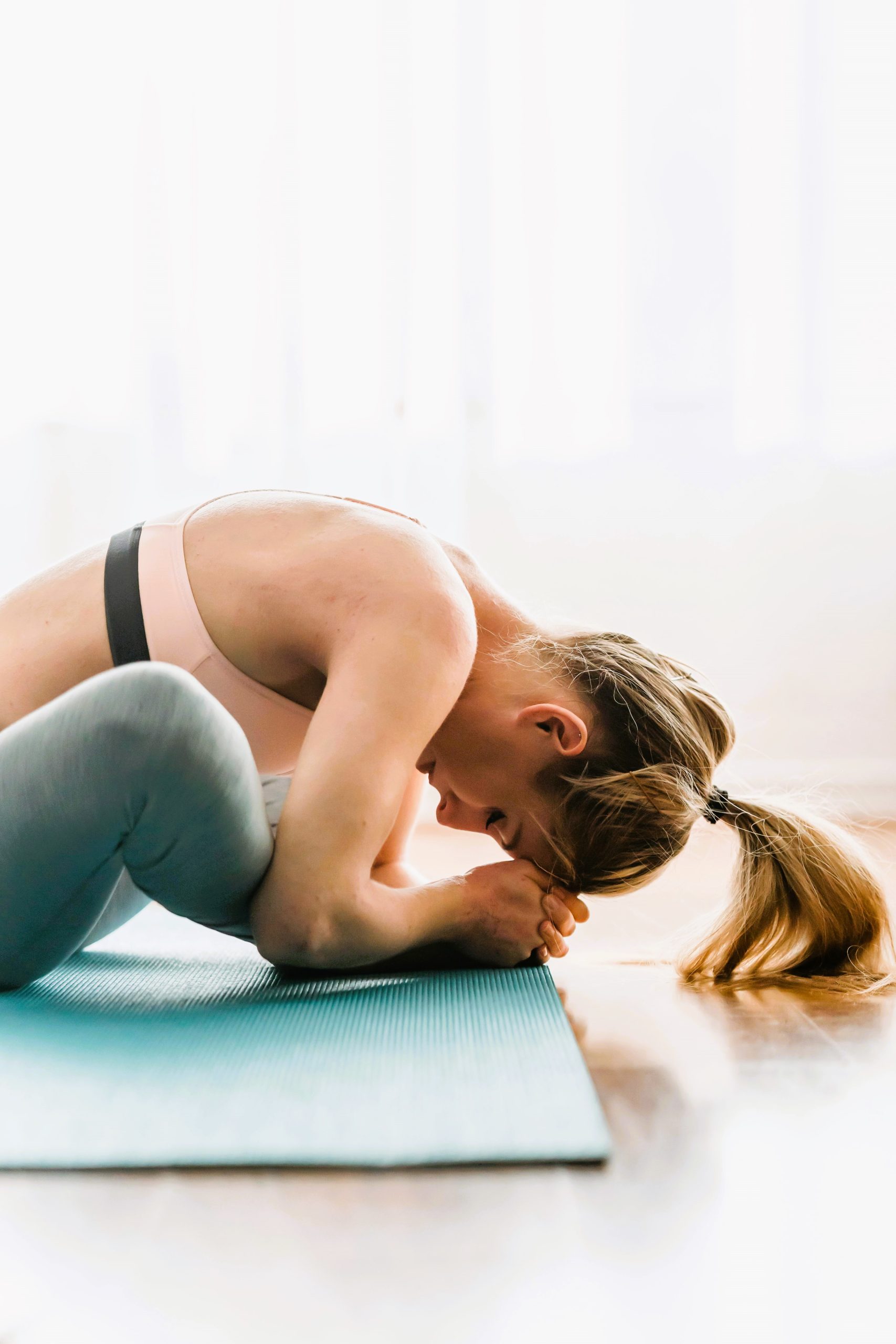 Lady stretching on a yoga mat