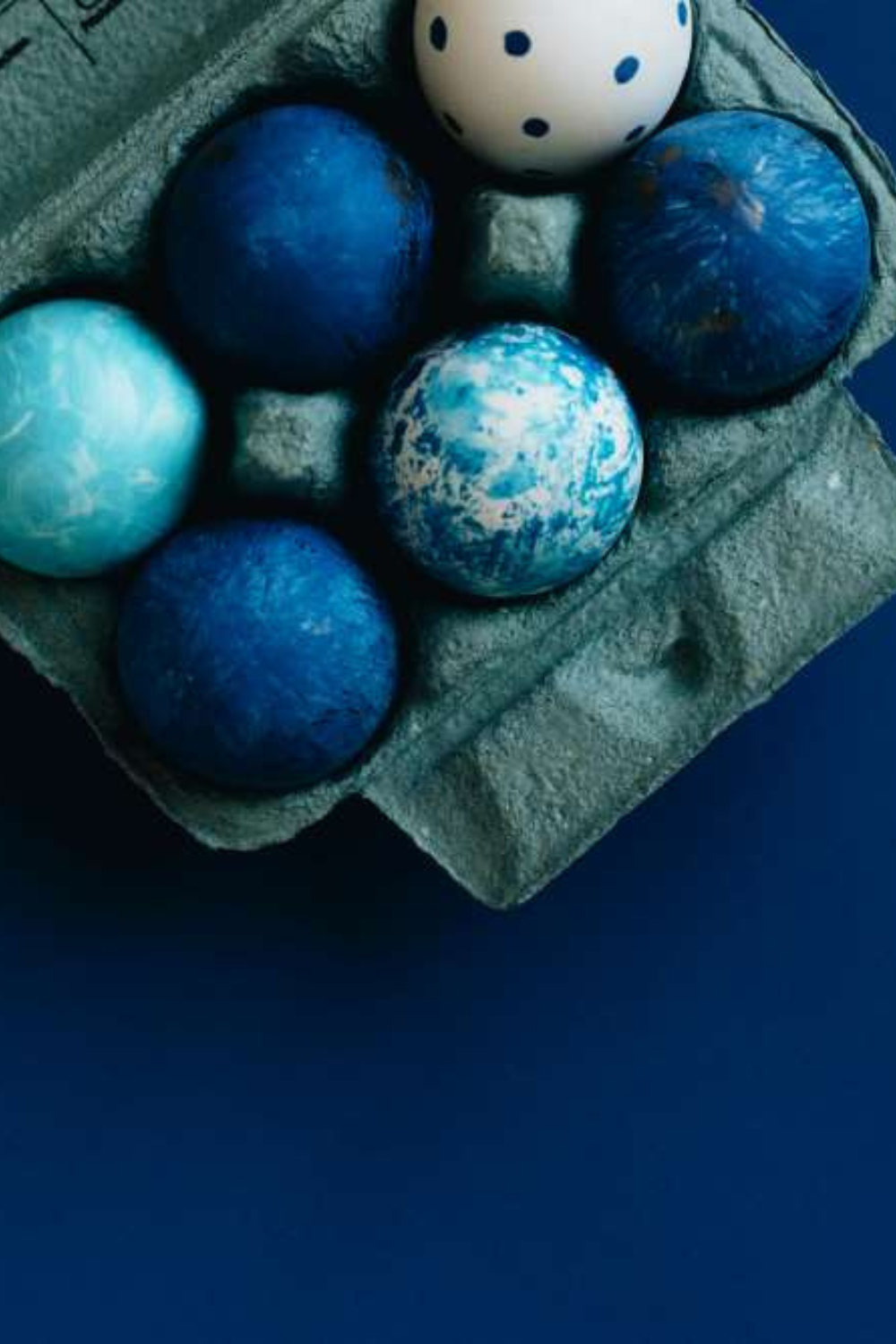 A collection of blue-colored eggs nestled together