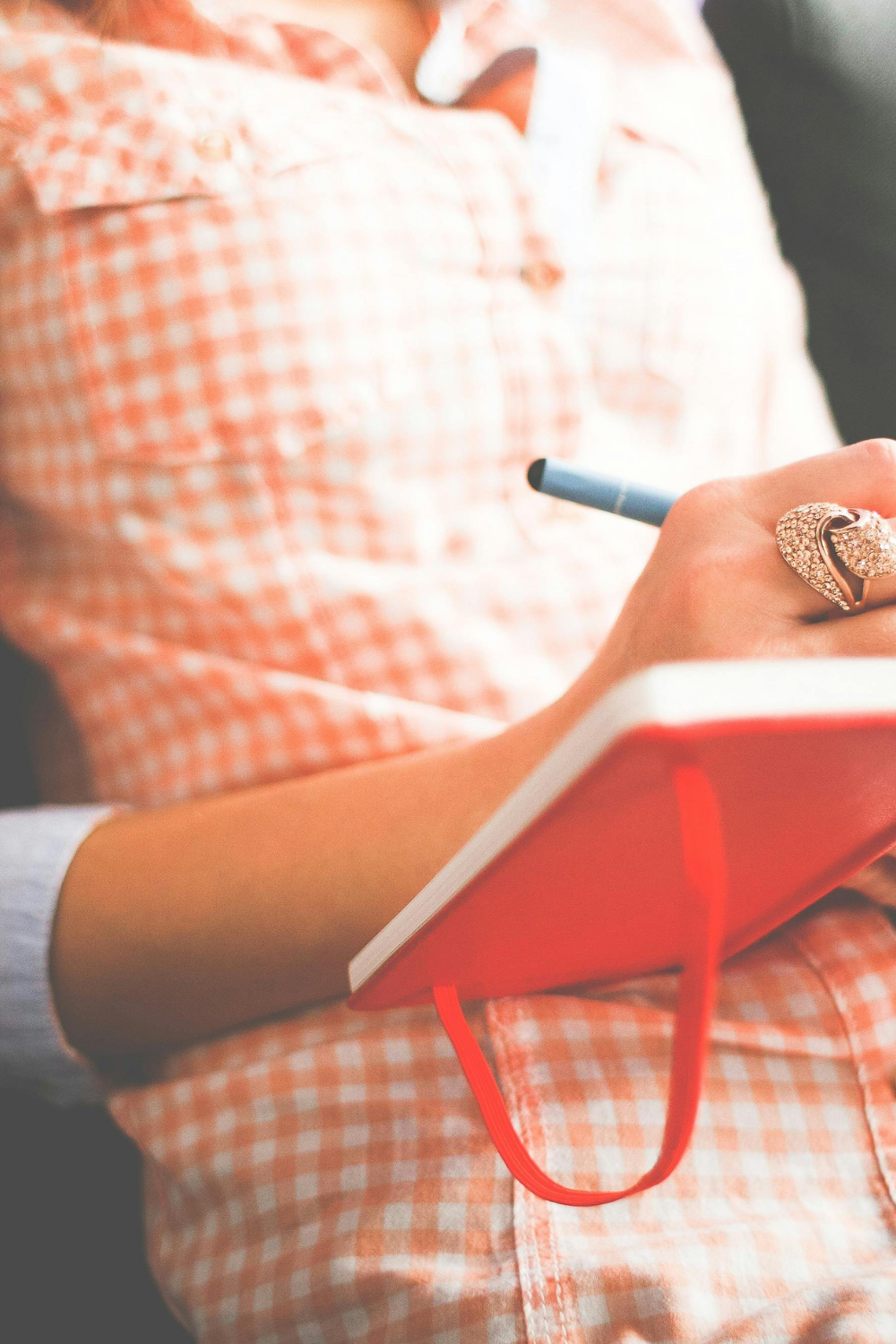A serene woman journaling