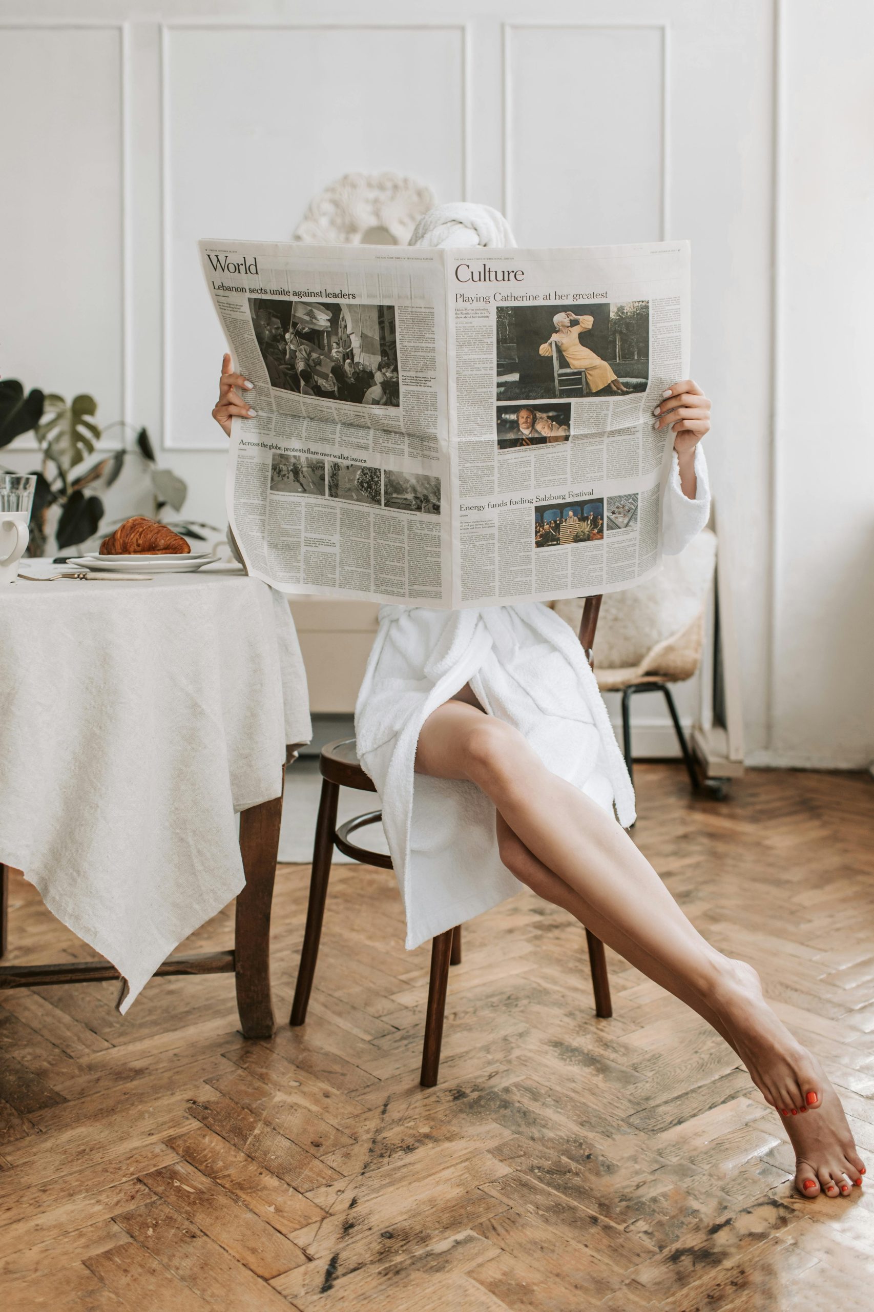 A lady reading the morning news