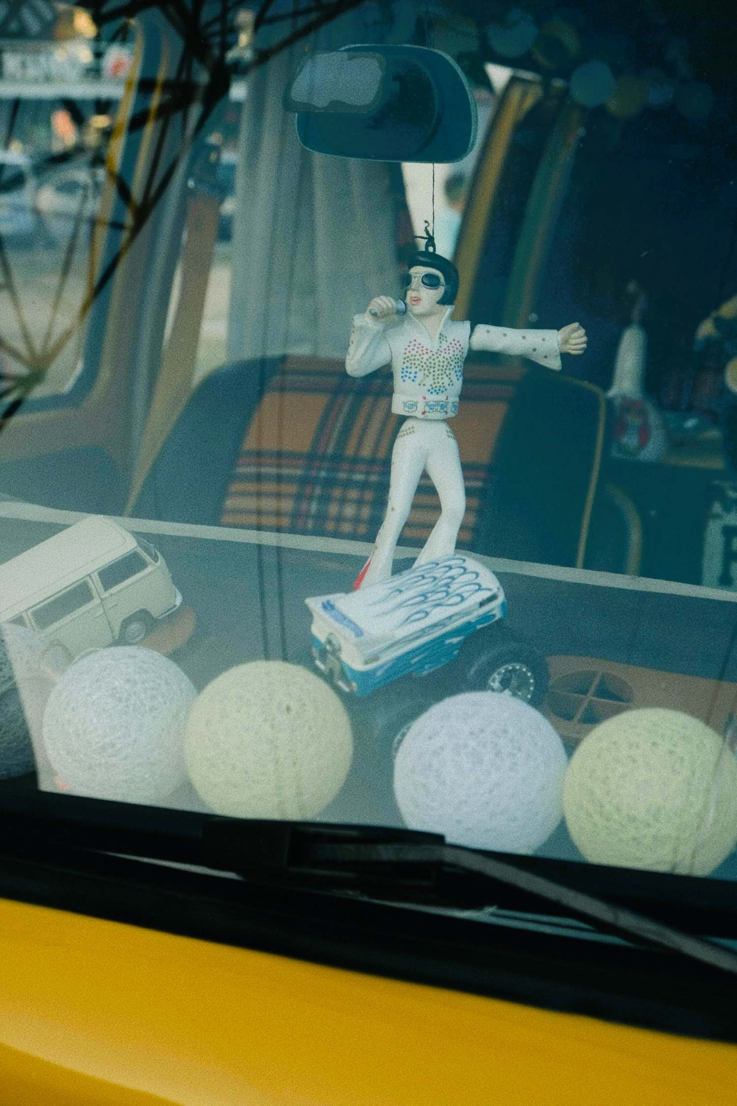 Elvis Presley figurines in the car