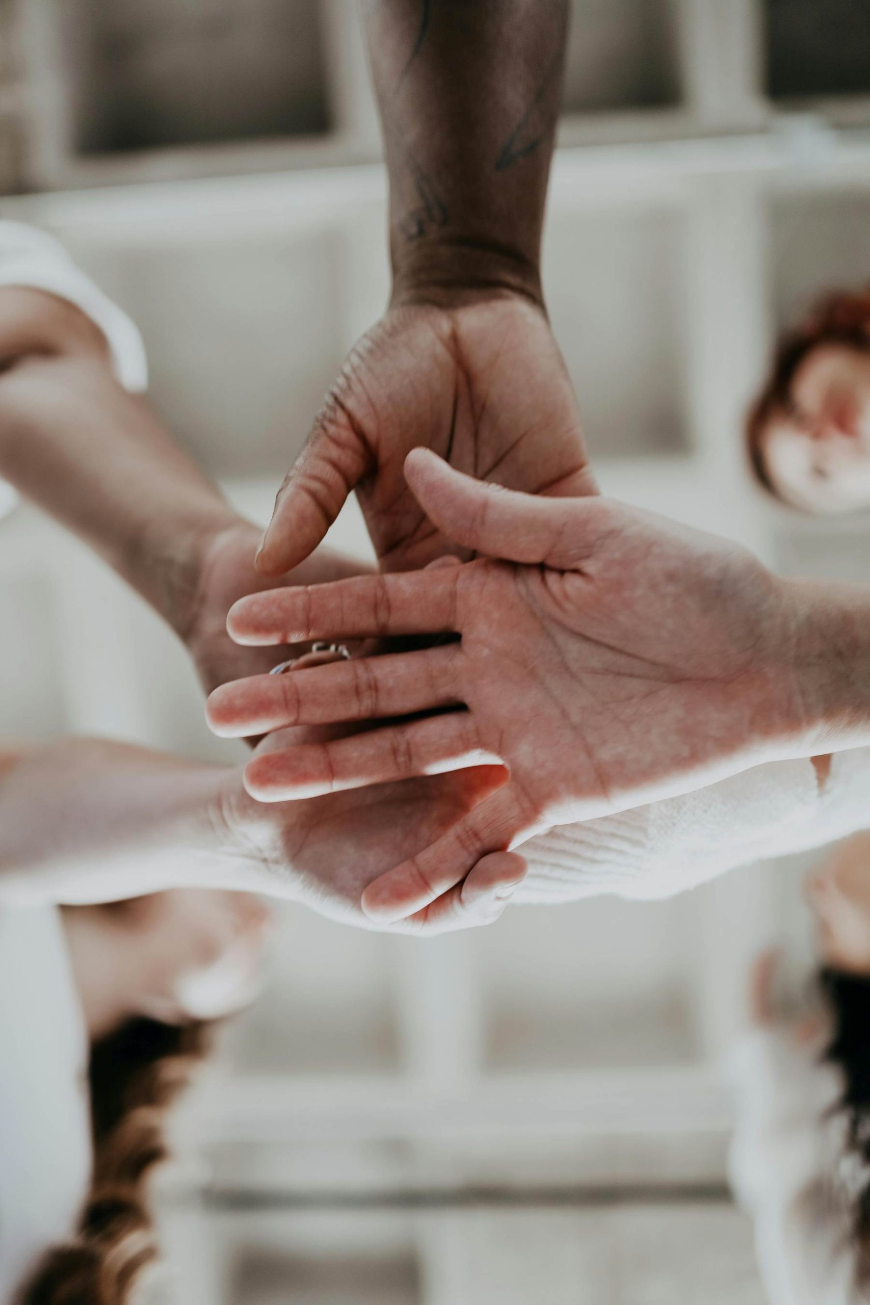 Multiple hands symbolizing unions and partnerships