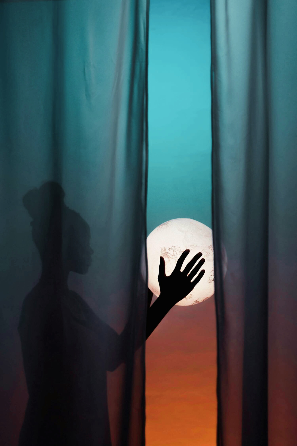 a lady gently holding the glowing full moon in her hands