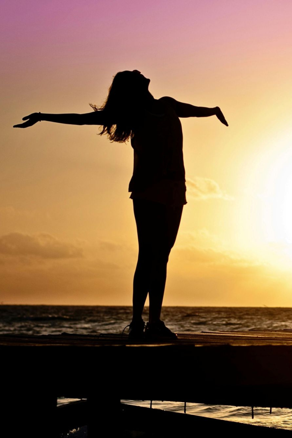 A lady standing in the sunrise