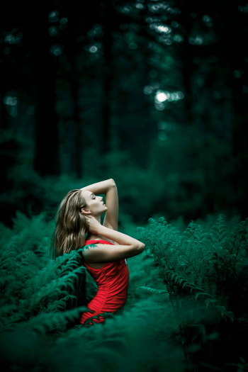 A woman in green nature